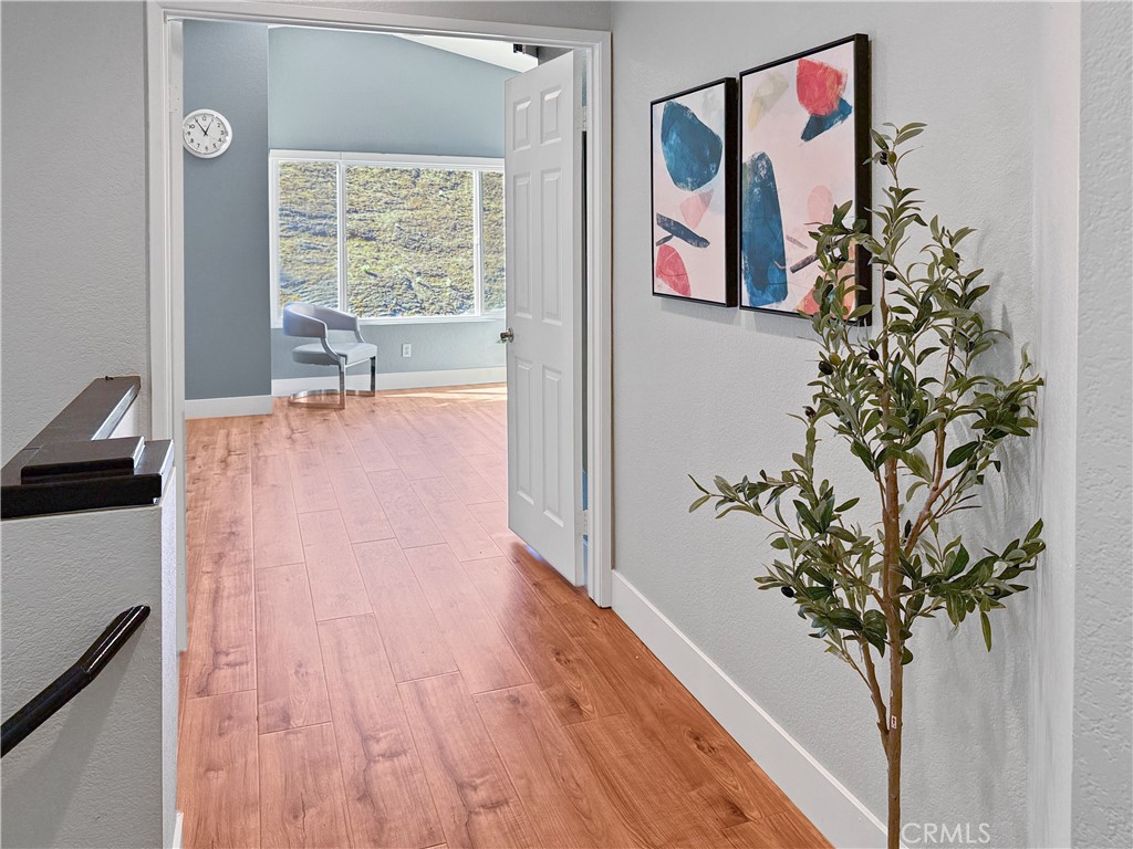 16955 Lake Knoll Parkway Riverside, CA 92503 - Photo 14 of 42 a view of a room with wooden floor and plant