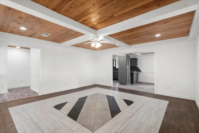 a view of a room with window and ceiling fan