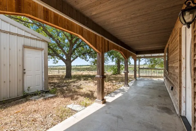 a view of balcony with wooden floor