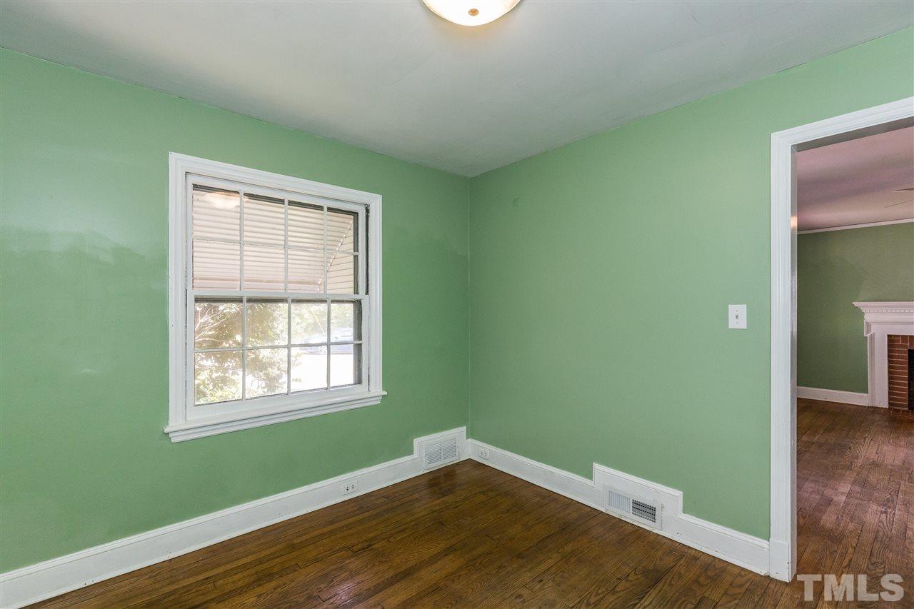 614 Elm Street Raleigh, NC 27604 - Photo 12 of 30 a view of empty room with wooden floor and fan