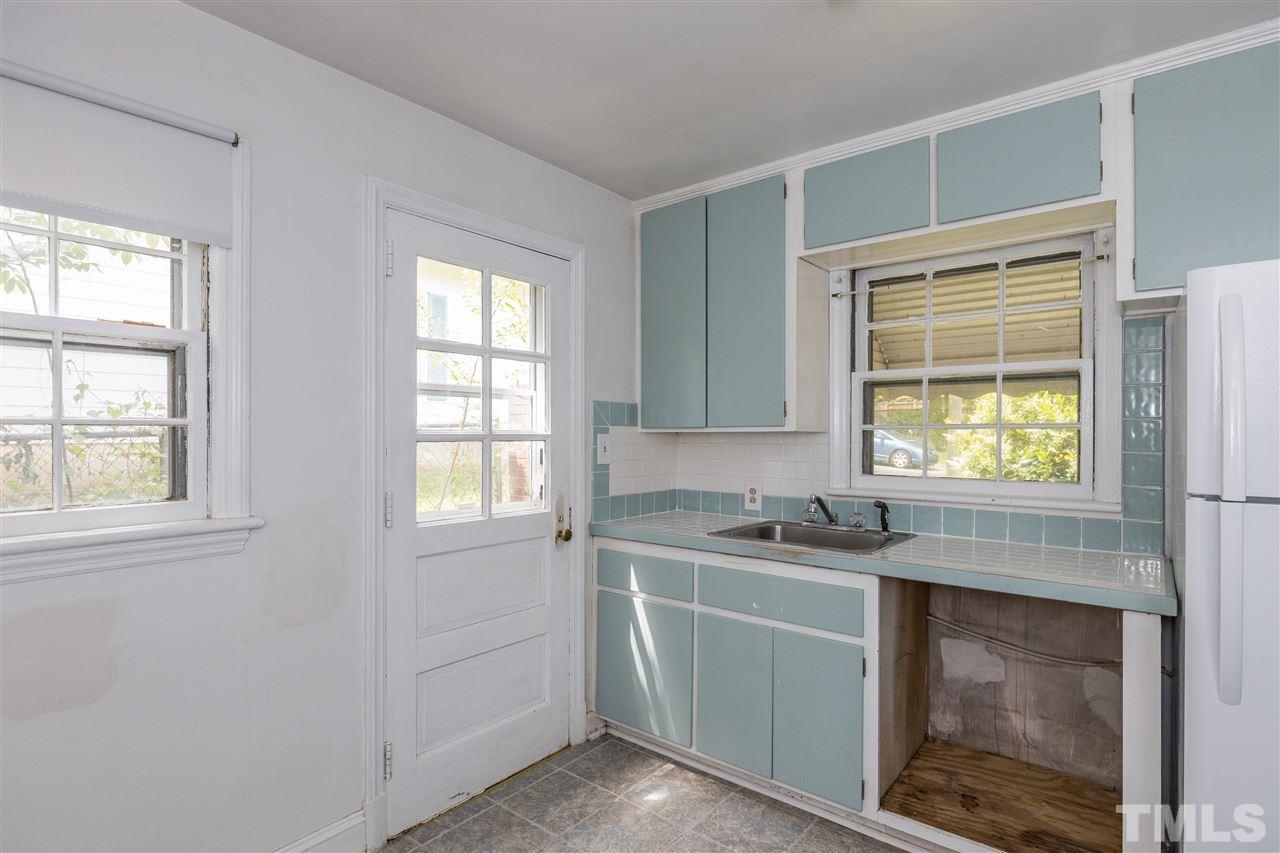 614 Elm Street Raleigh, NC 27604 - Photo 15 of 30 a kitchen with a sink and cabinets