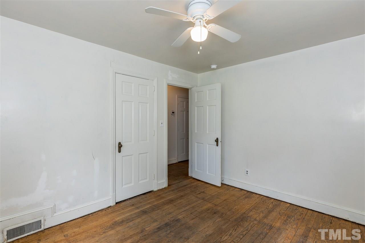 614 Elm Street Raleigh, NC 27604 - Photo 22 of 30 an empty room with wooden floor and fan