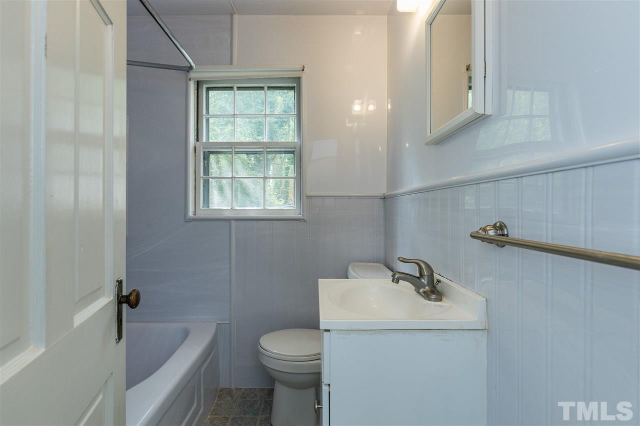 614 Elm Street Raleigh, NC 27604 - Photo 23 of 30 a bathroom with a sink a toilet and shower