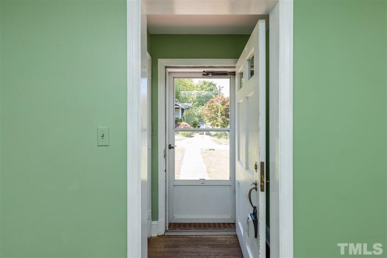 614 Elm Street Raleigh, NC 27604 - Photo 6 of 30 a view of a hallway with wooden floor