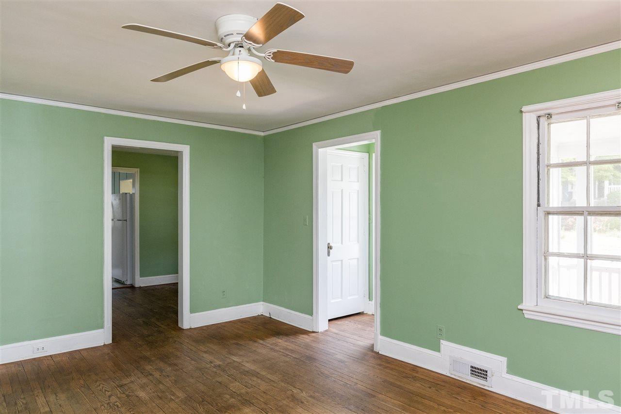 614 Elm Street Raleigh, NC 27604 - Photo 9 of 30 a view of an empty room with window and wooden floor