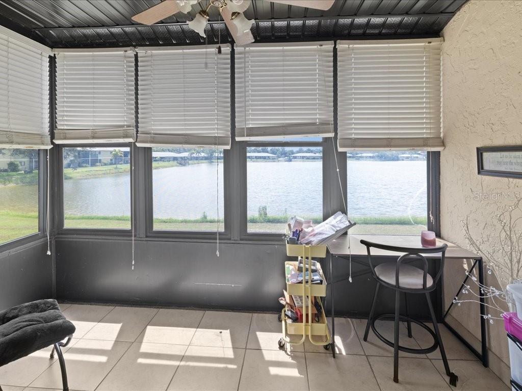 25275 Rampart Boulevard, Unit 1607 Punta Gorda, FL 33983 - Photo 17 of 23 a balcony with table and chairs