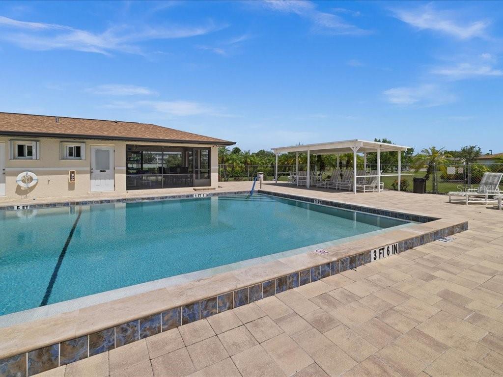 25275 Rampart Boulevard, Unit 1607 Punta Gorda, FL 33983 - Photo 21 of 23 a view of a house with a yard