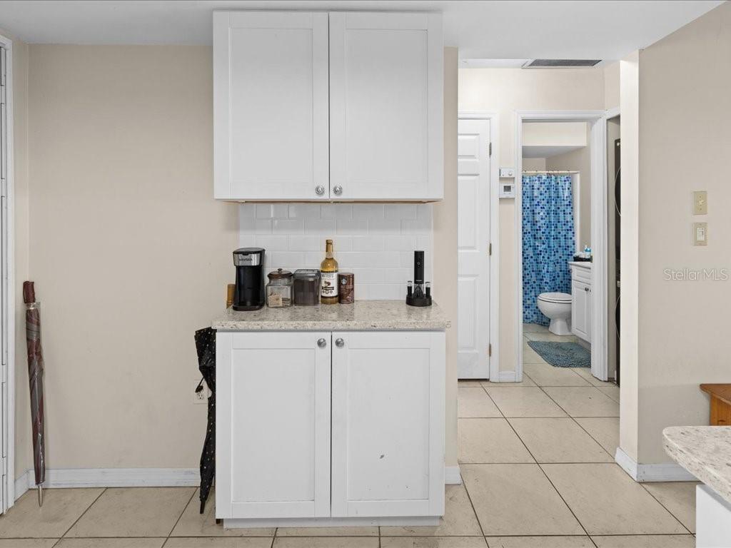 25275 Rampart Boulevard, Unit 1607 Punta Gorda, FL 33983 - Photo 3 of 23 a kitchen with a sink and cabinets