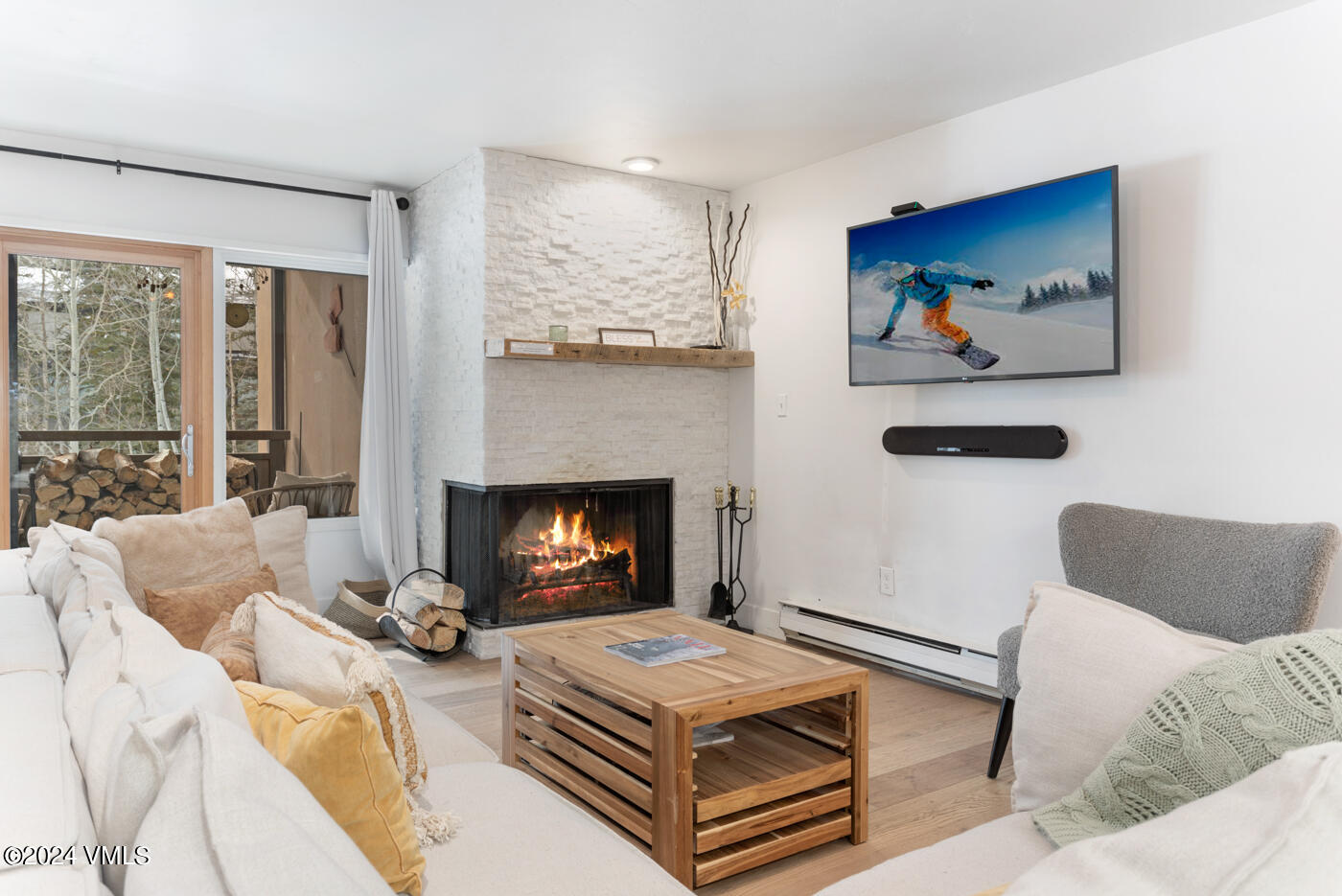 1650 Fall Ridge Road, Unit 401 Vail, CO 81657 - Photo 1 of 29 a living room with furniture and a fireplace