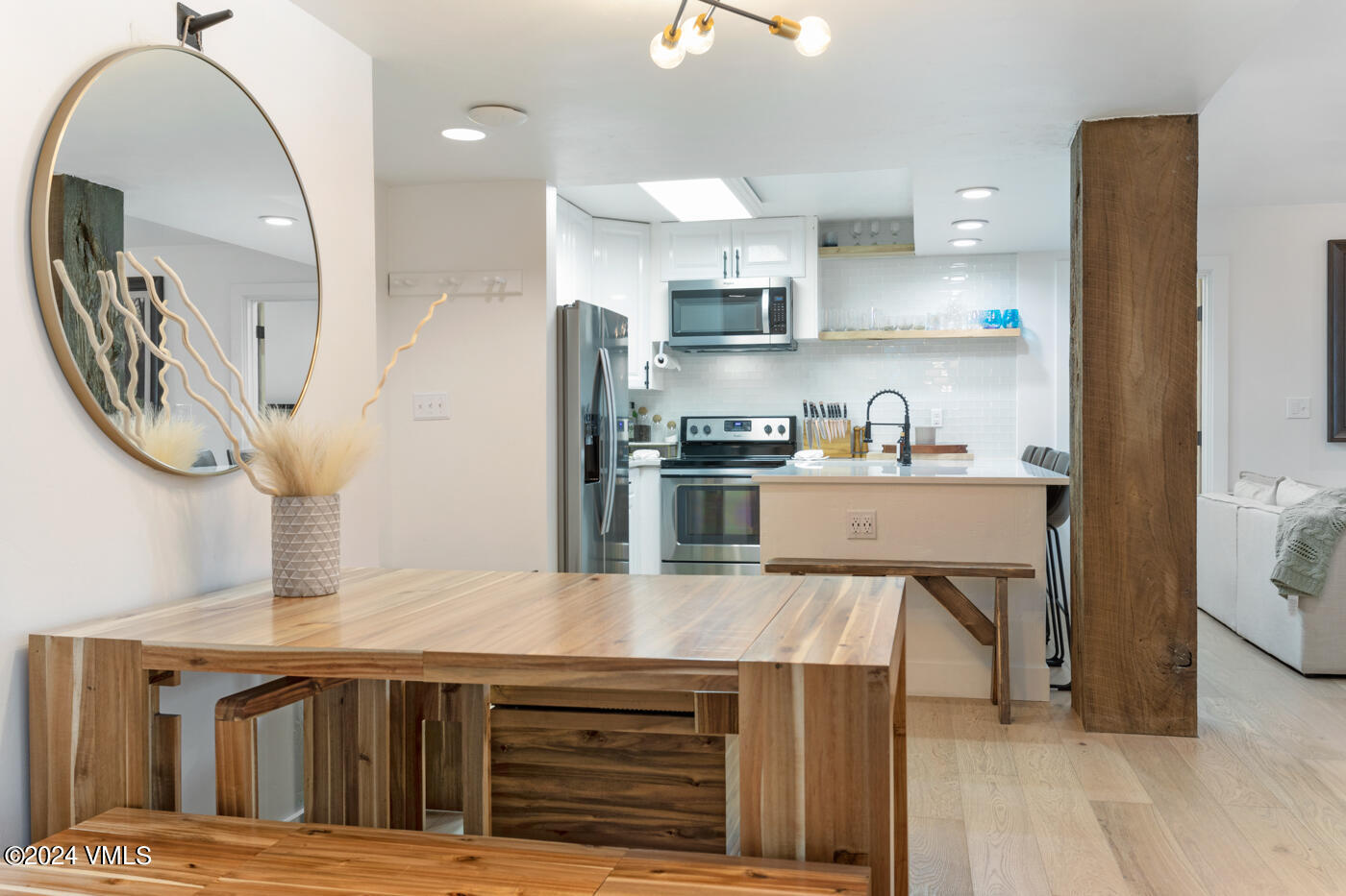 1650 Fall Ridge Road, Unit 401 Vail, CO 81657 - Photo 12 of 29 a kitchen with stainless steel appliances granite countertop a sink a stove and a wooden floors