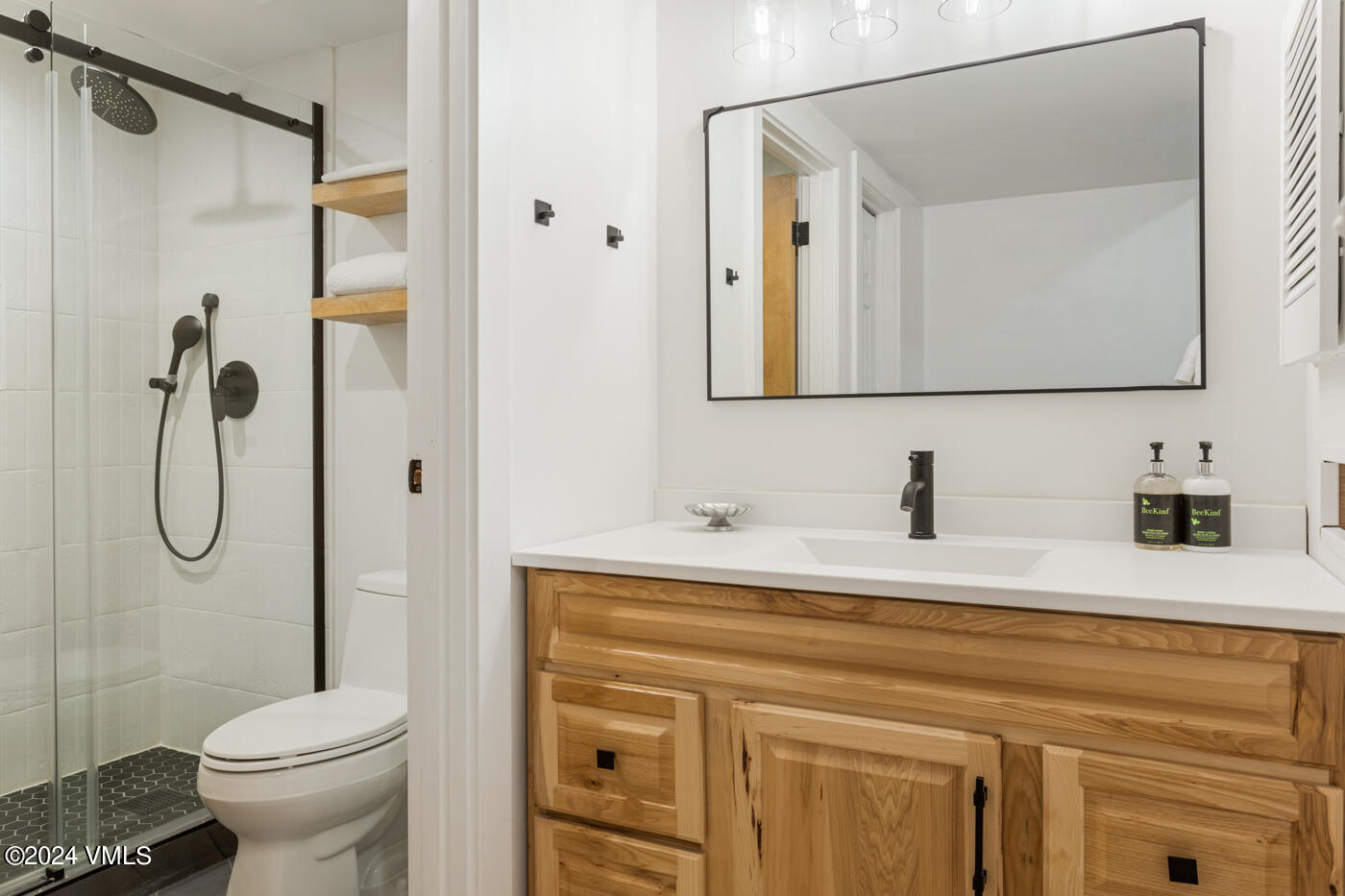 1650 Fall Ridge Road, Unit 401 Vail, CO 81657 - Photo 16 of 29 a bathroom with a sink toilet and shower