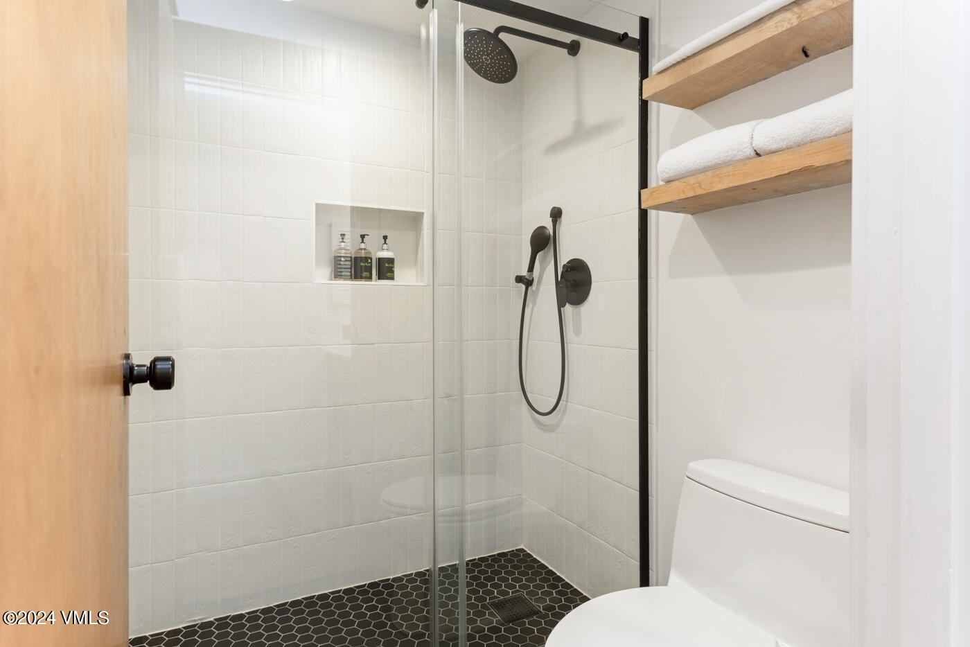 1650 Fall Ridge Road, Unit 401 Vail, CO 81657 - Photo 17 of 29 a bathroom with a shower toilet and sink