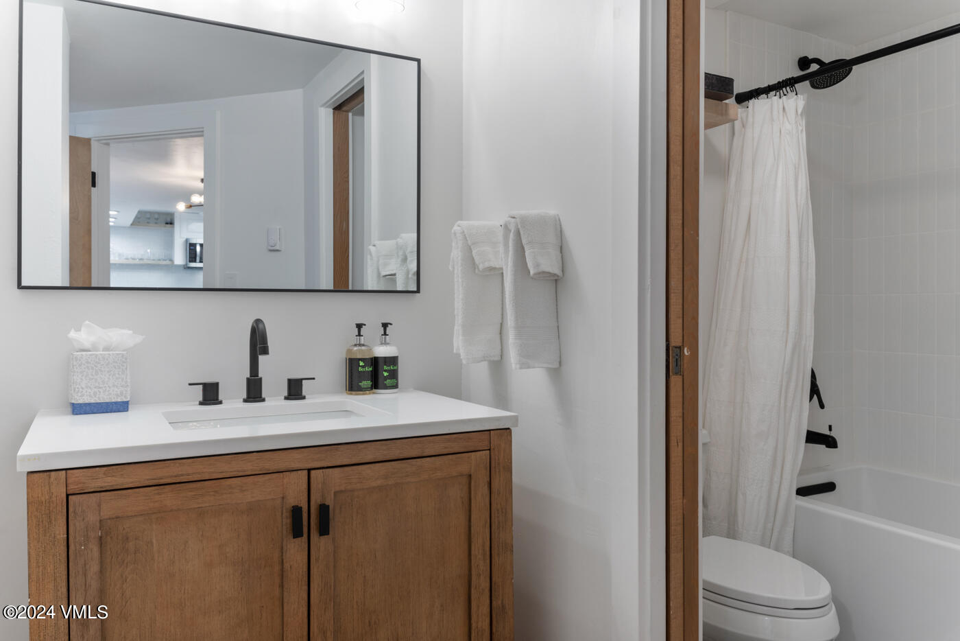 1650 Fall Ridge Road, Unit 401 Vail, CO 81657 - Photo 20 of 29 a bathroom with a granite countertop sink toilet and shower