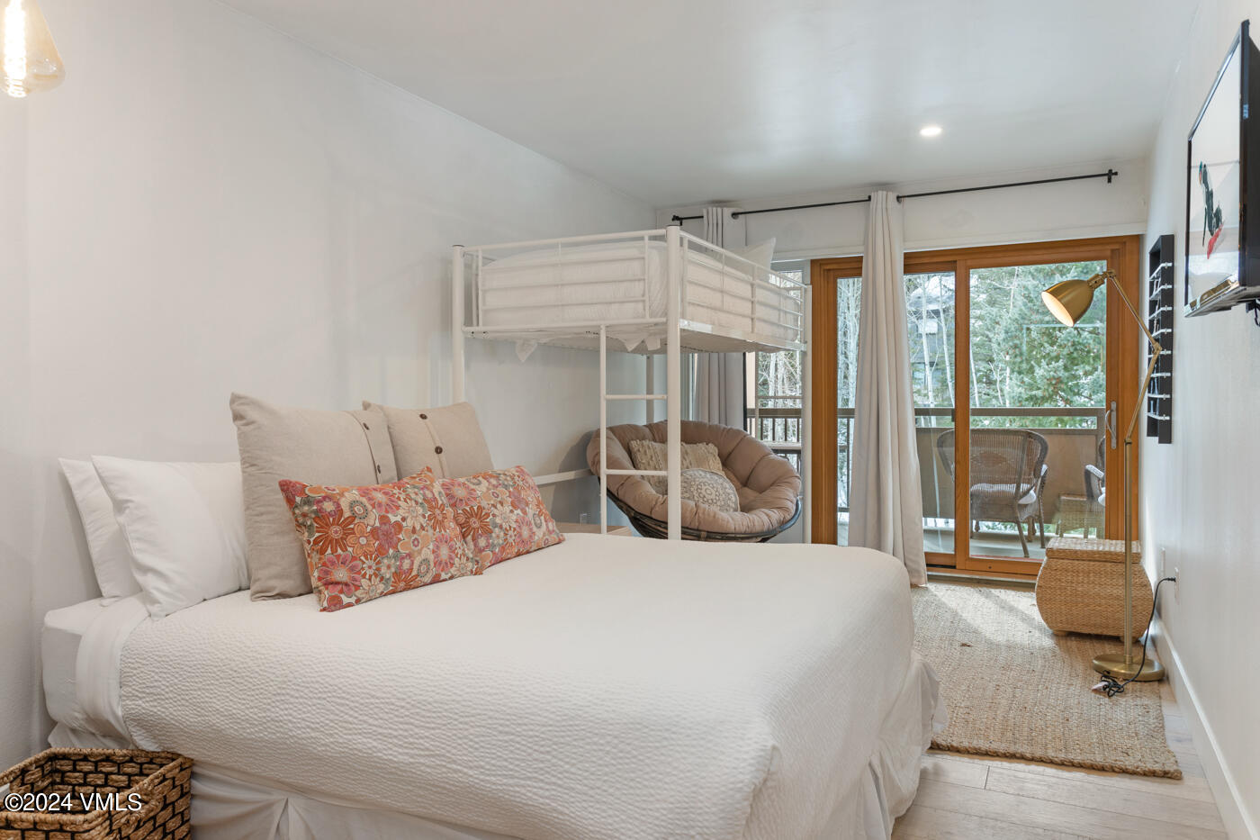 1650 Fall Ridge Road, Unit 401 Vail, CO 81657 - Photo 21 of 29 a bedroom with a bed and glass door