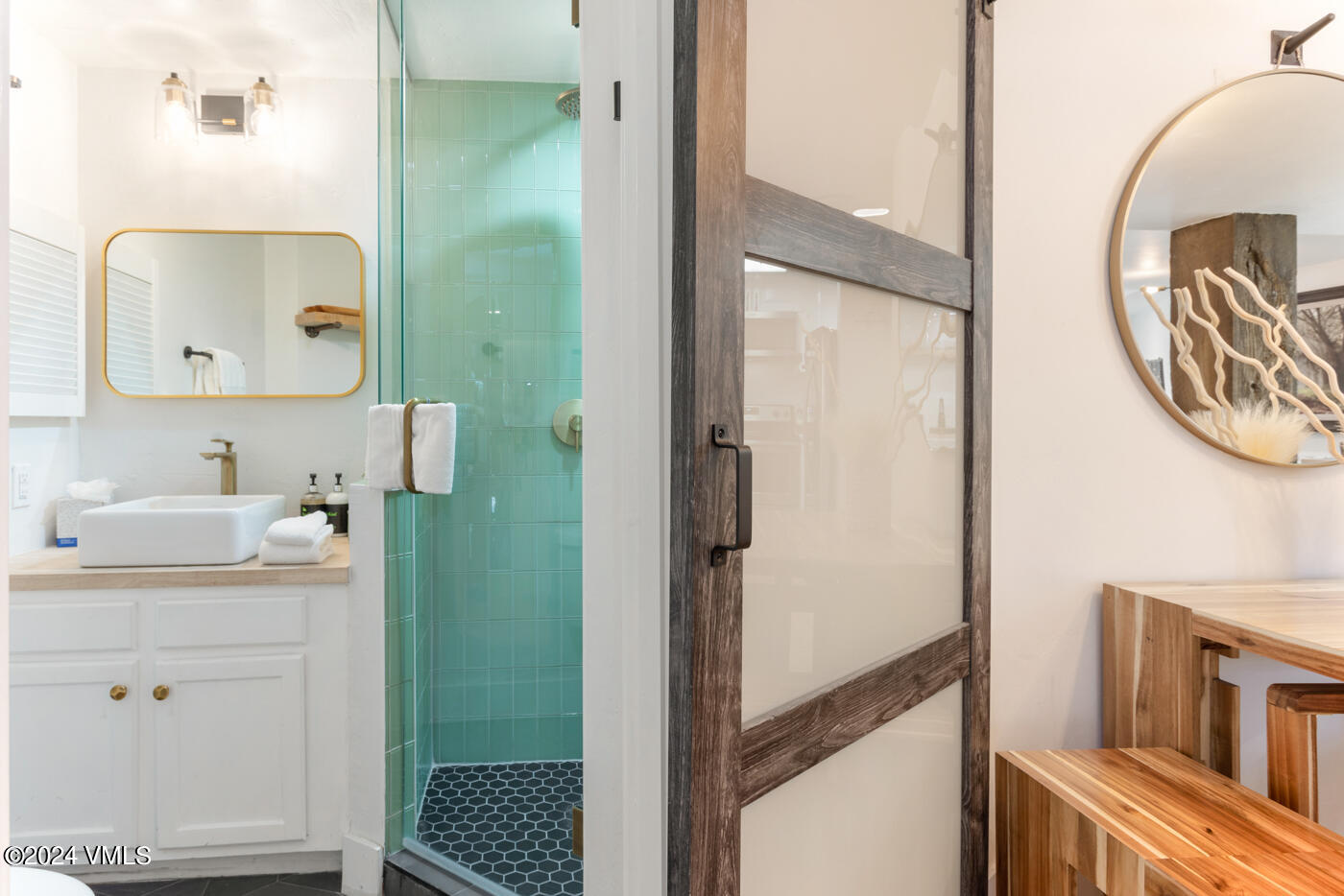 1650 Fall Ridge Road, Unit 401 Vail, CO 81657 - Photo 23 of 29 a bathroom with a sink a toilet and a mirror