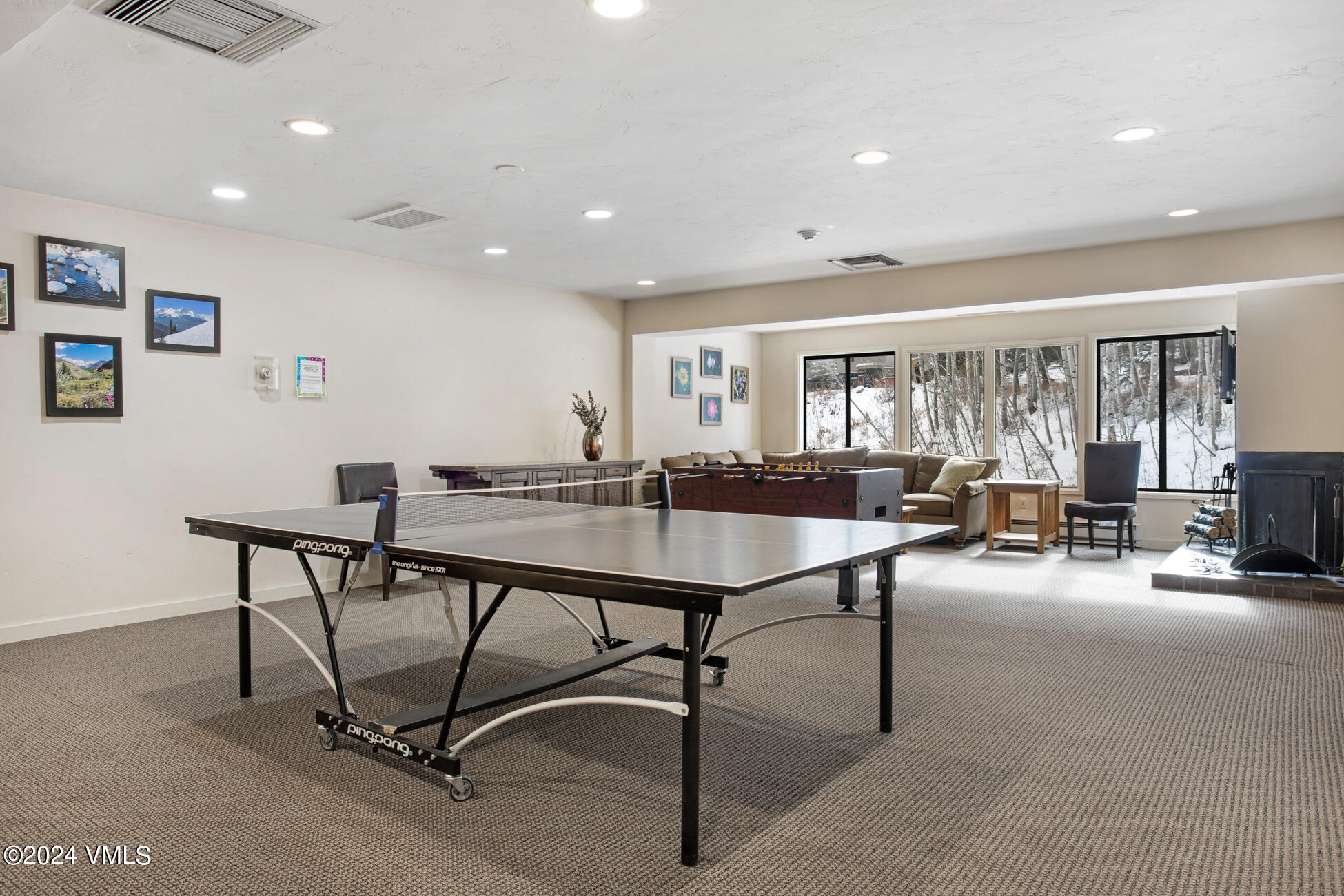 1650 Fall Ridge Road, Unit 401 Vail, CO 81657 - Photo 25 of 29 a living room with furniture and a table