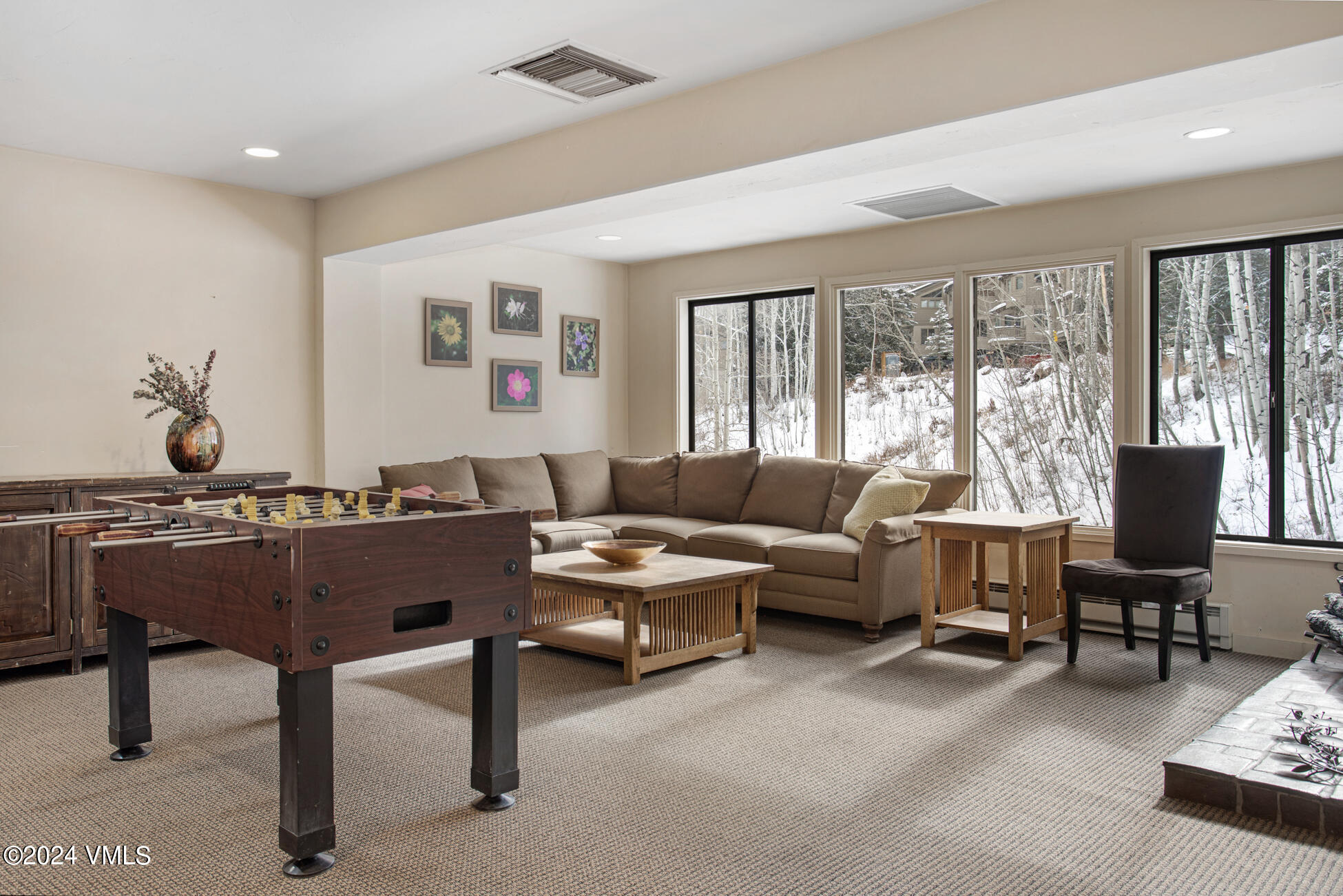 1650 Fall Ridge Road, Unit 401 Vail, CO 81657 - Photo 26 of 29 a living room with furniture and large windows