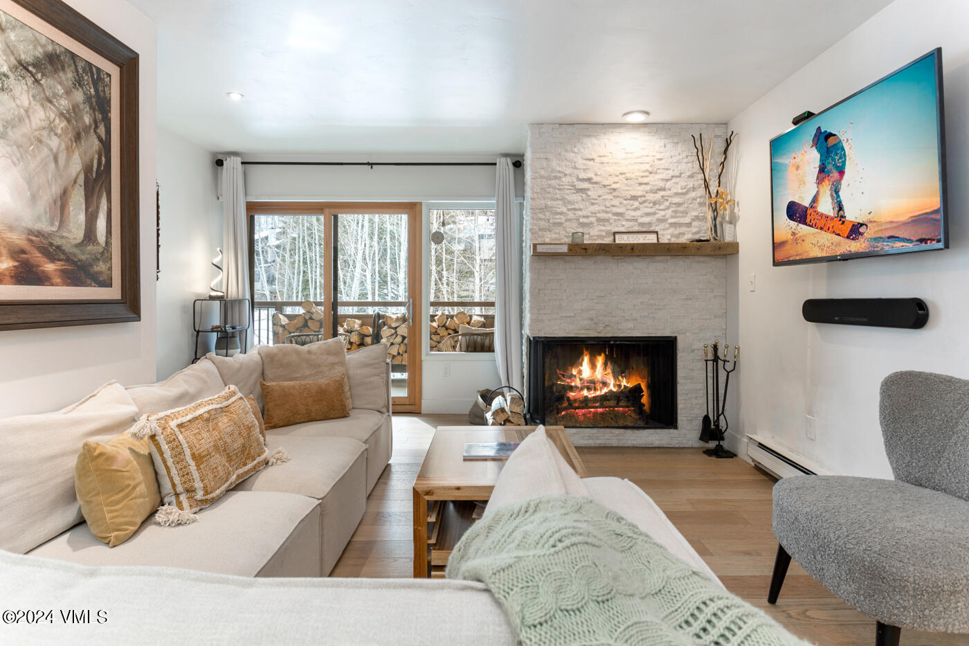 1650 Fall Ridge Road, Unit 401 Vail, CO 81657 - Photo 3 of 29 a living room with furniture and a fireplace