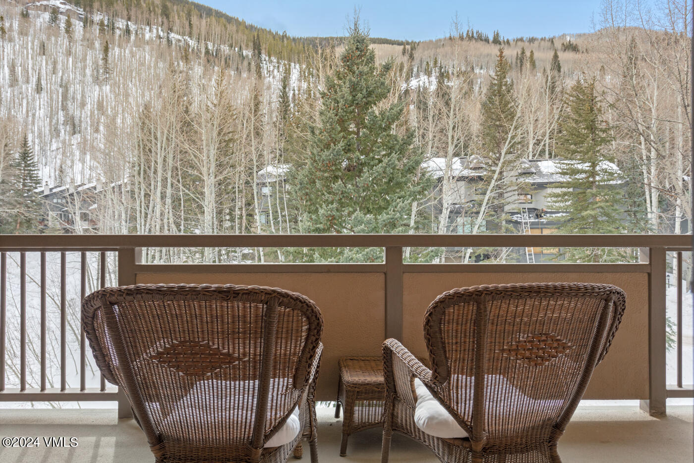 1650 Fall Ridge Road, Unit 401 Vail, CO 81657 - Photo 5 of 29 a view of a balcony with furniture and wooden floor