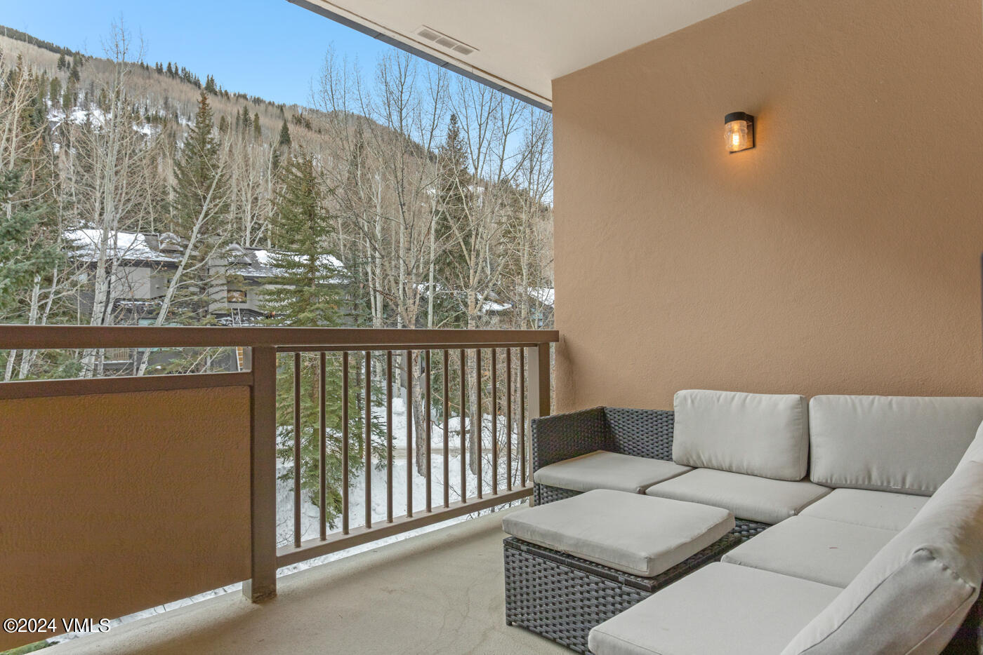 1650 Fall Ridge Road, Unit 401 Vail, CO 81657 - Photo 6 of 29 a living room with furniture and a large window