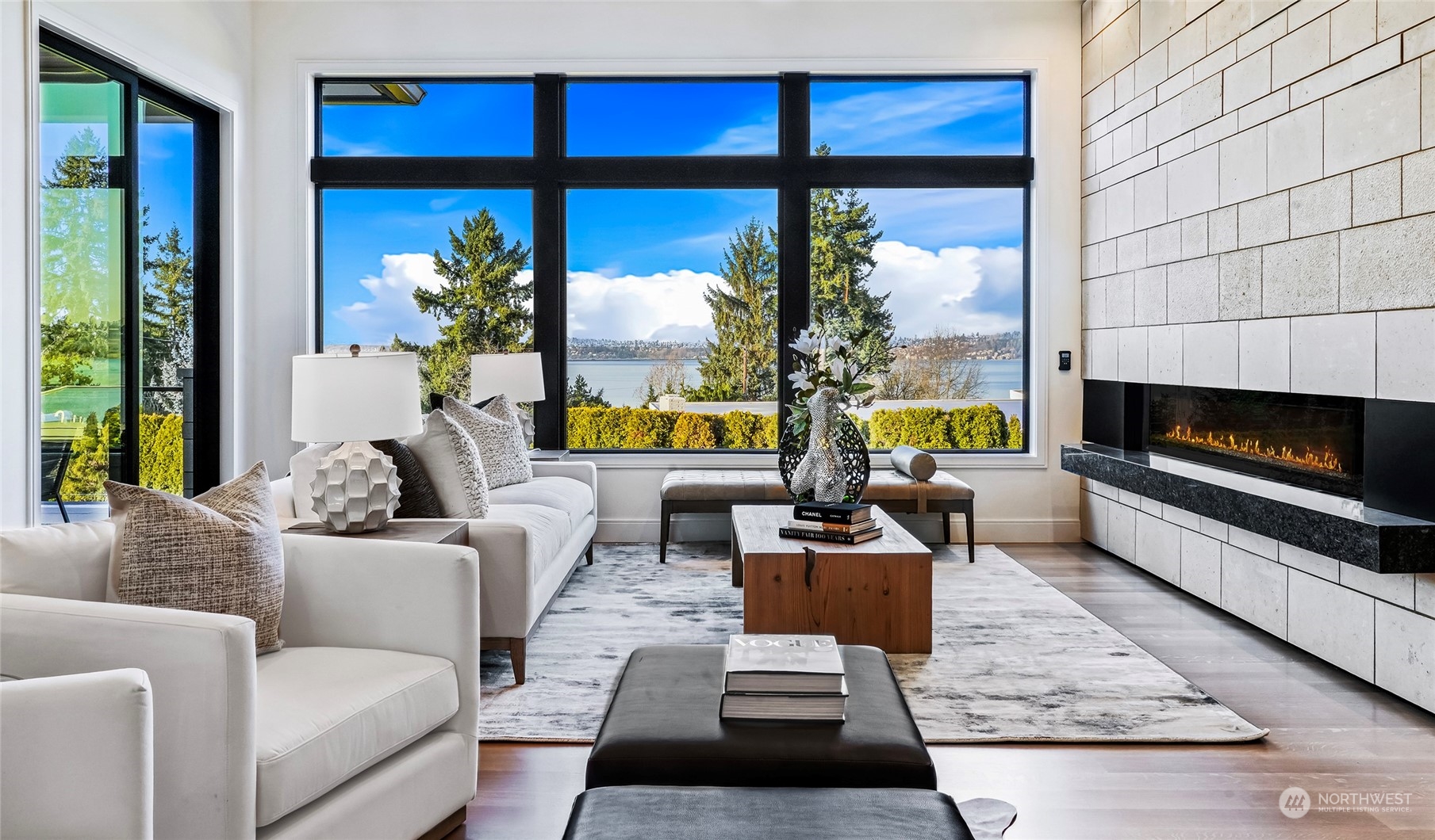 8467 Midland Road Medina, WA 98039 - Photo 12 of 40 a living room with furniture fireplace and a large window