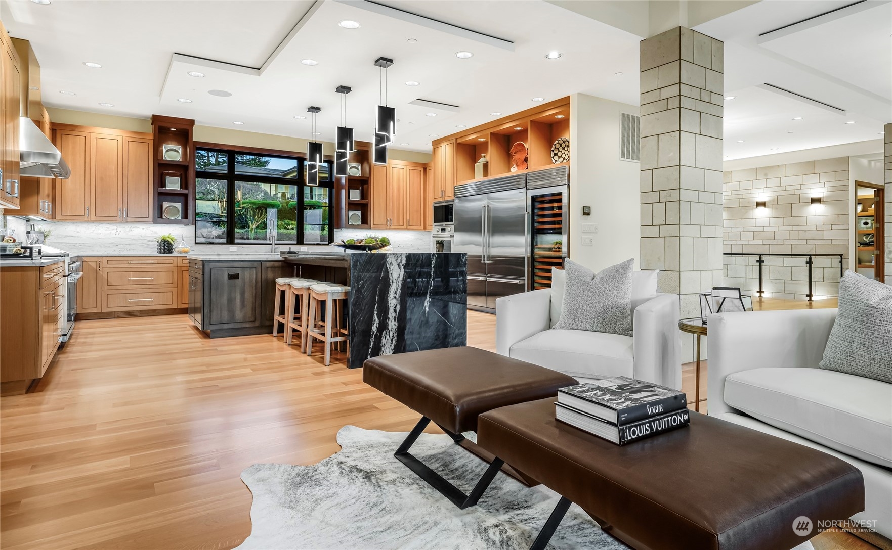 8467 Midland Road Medina, WA 98039 - Photo 17 of 40 a living room with stainless steel appliances kitchen island granite countertop furniture and a kitchen view