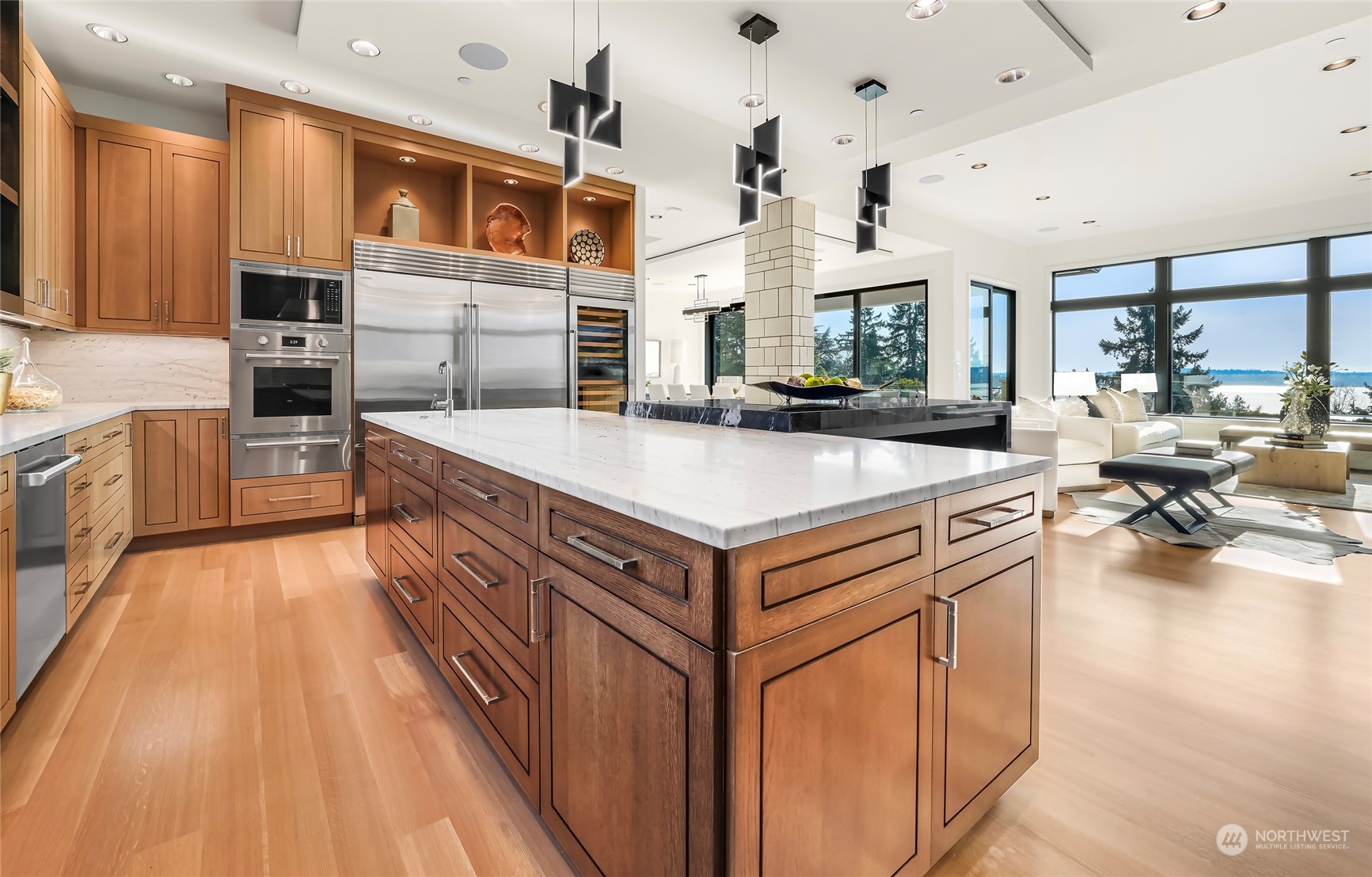 8467 Midland Road Medina, WA 98039 - Photo 18 of 40 a large kitchen with stainless steel appliances granite countertop a lot of cabinets and wooden floor