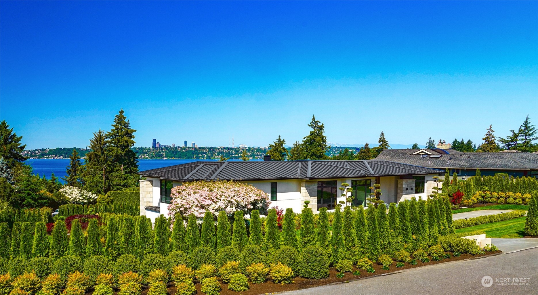 8467 Midland Road Medina, WA 98039 - Photo 2 of 40 a view of a swimming pool with a patio