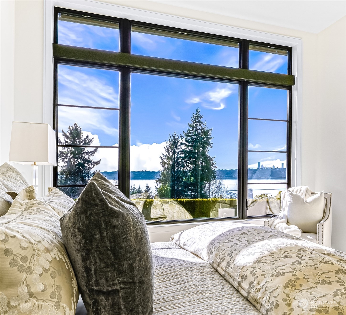 8467 Midland Road Medina, WA 98039 - Photo 26 of 40 a bedroom with a bed and a potted plant