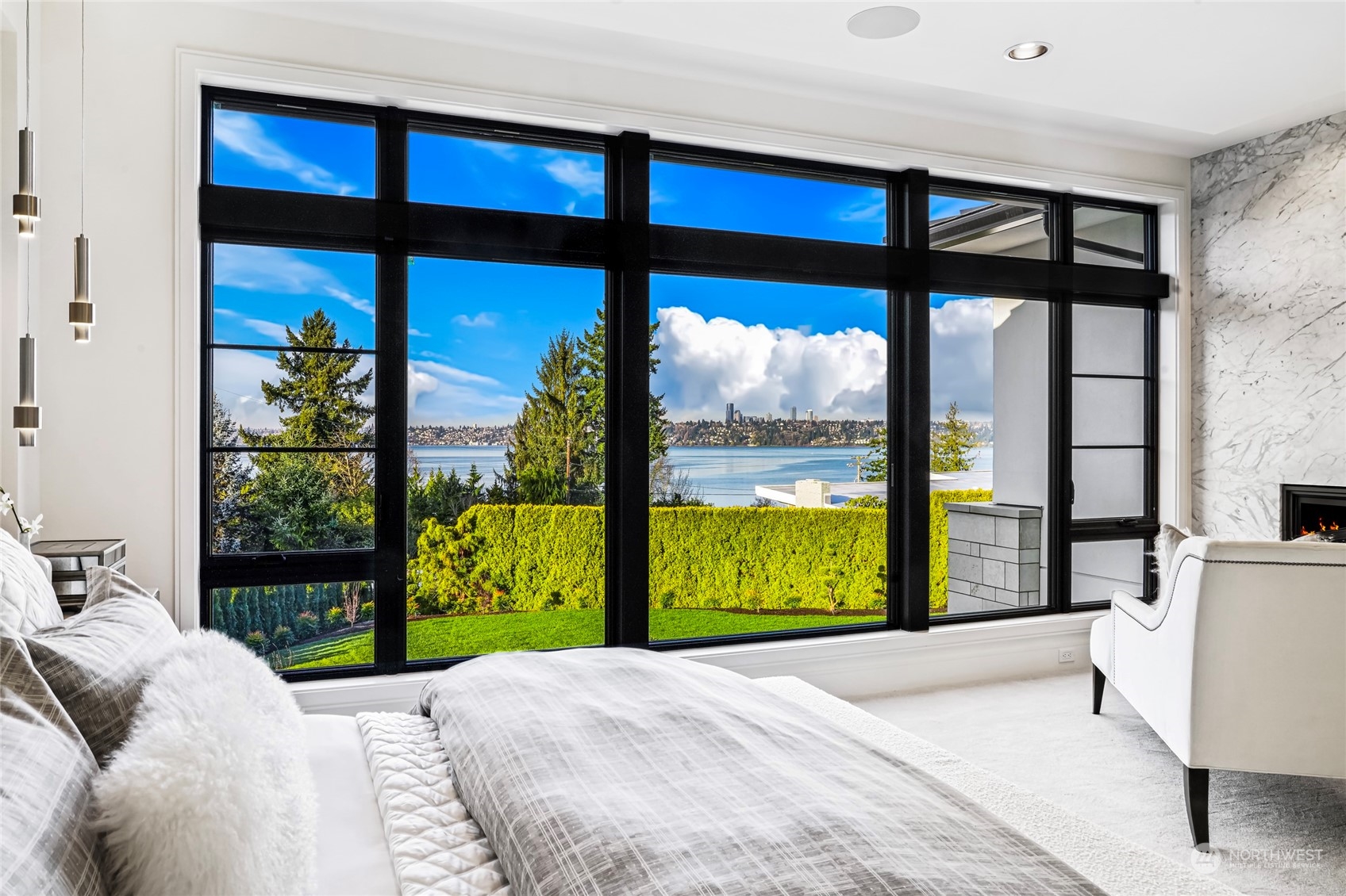 8467 Midland Road Medina, WA 98039 - Photo 28 of 40 a bedroom with a bed and large window