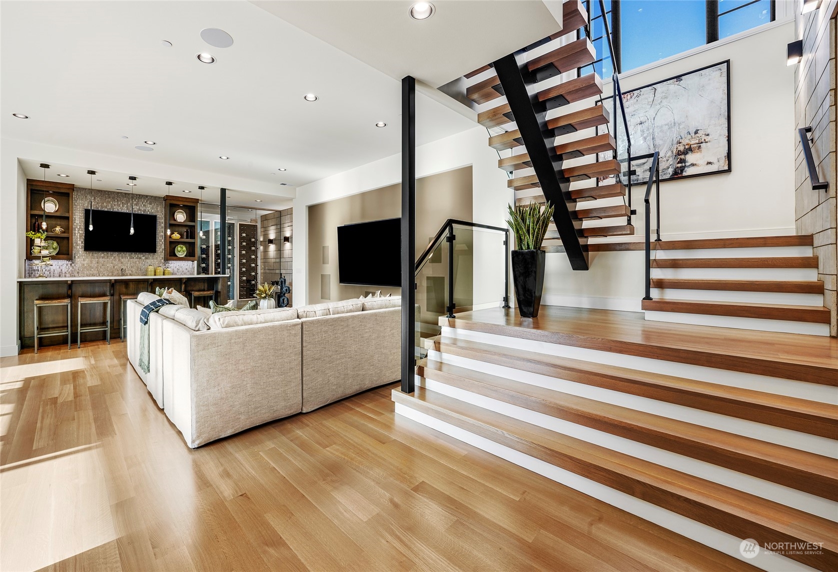 8467 Midland Road Medina, WA 98039 - Photo 34 of 40 a living room with furniture and a flat screen tv