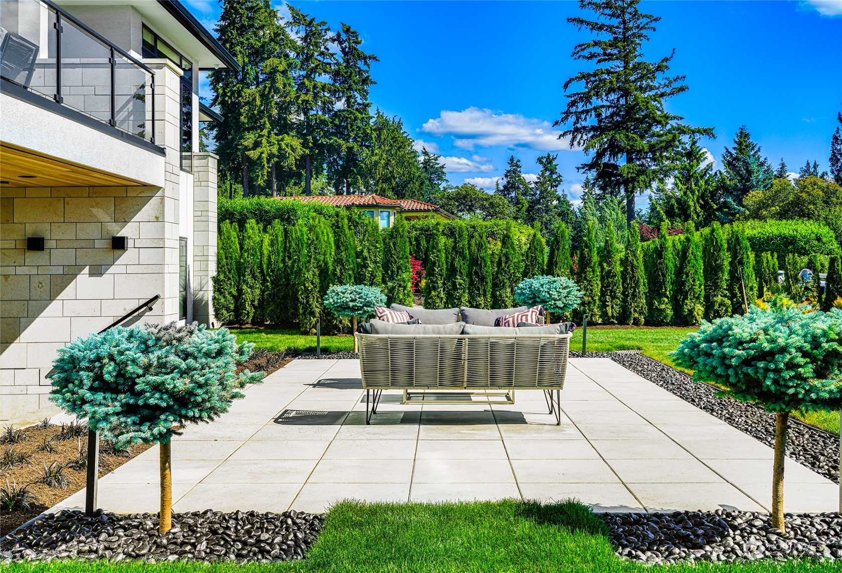 8467 Midland Road Medina, WA 98039 - Photo 8 of 40 a view of a patio with table and chairs potted plants and palm tree