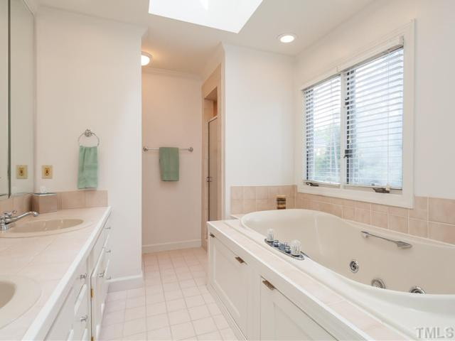1917 Prescott Place Raleigh, NC 27615 - Photo 16 of 25 The master bath offers a jetted tub, walk-in shower, dual sinks, skylight, and casement windows. Master Bath/Spa