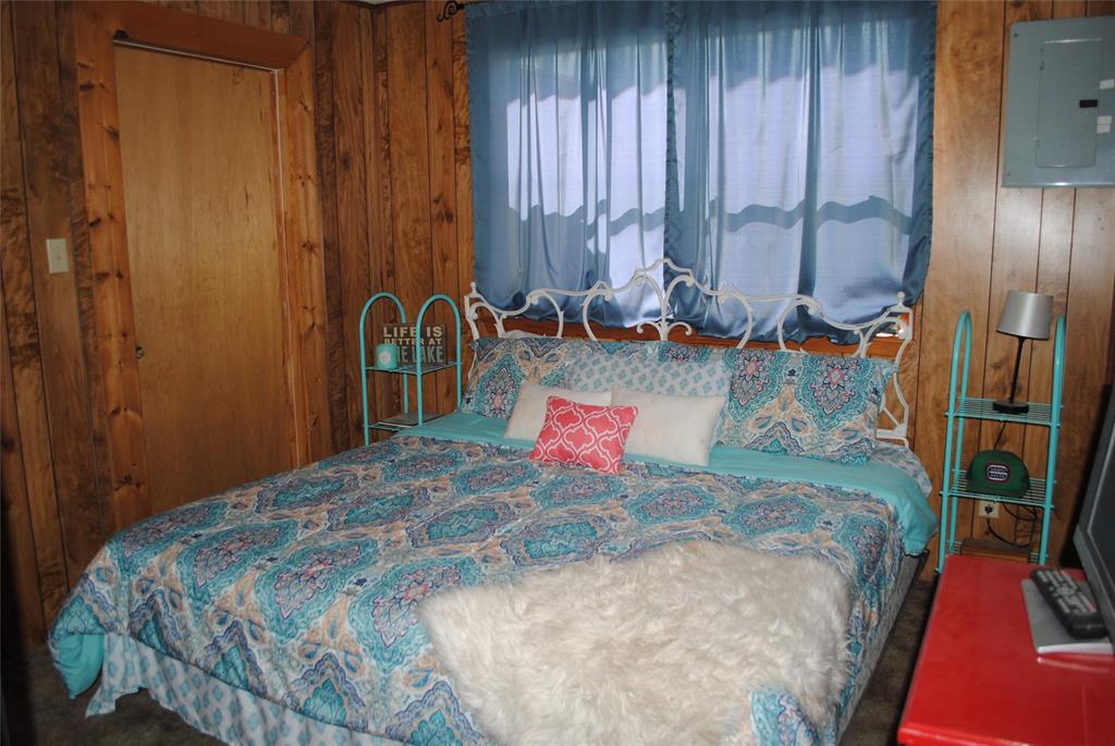 73-109 109th Goldthwaite, TX 76844 - Photo 14 of 37 a bed sitting in a bedroom next to a window