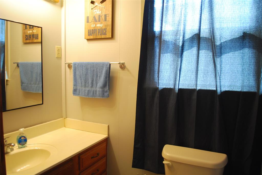 73-109 109th Goldthwaite, TX 76844 - Photo 15 of 37 a bathroom with a sink and a toilet