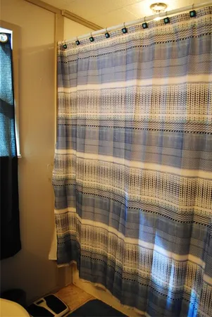 a bedroom with a bed and a cabinet