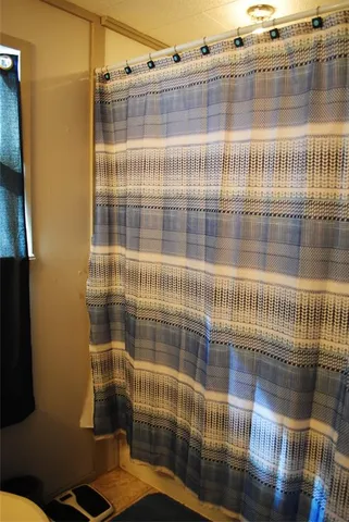 a bedroom with a bed and a cabinet