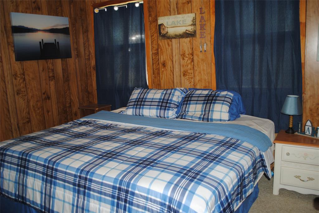 73-109 109th Goldthwaite, TX 76844 - Photo 17 of 37 a bedroom with a bed and a cabinet