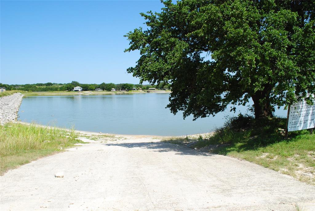 73-109 109th Goldthwaite, TX 76844 - Photo 3 of 37 a view of a lake from a yard