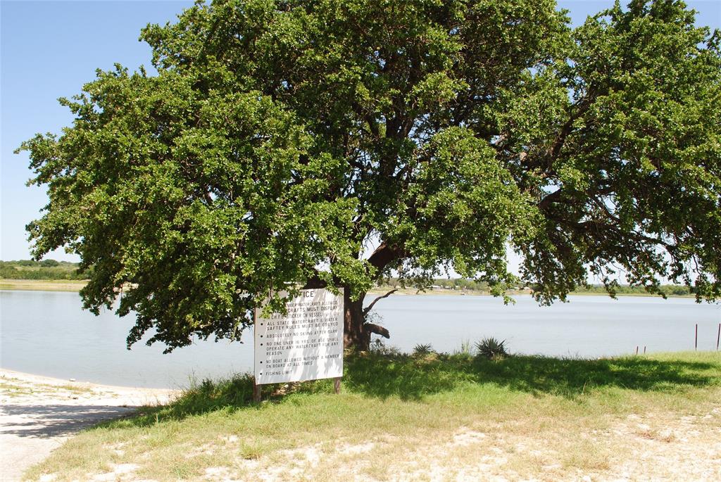 73-109 109th Goldthwaite, TX 76844 - Photo 31 of 37 a view of a lake from a yard