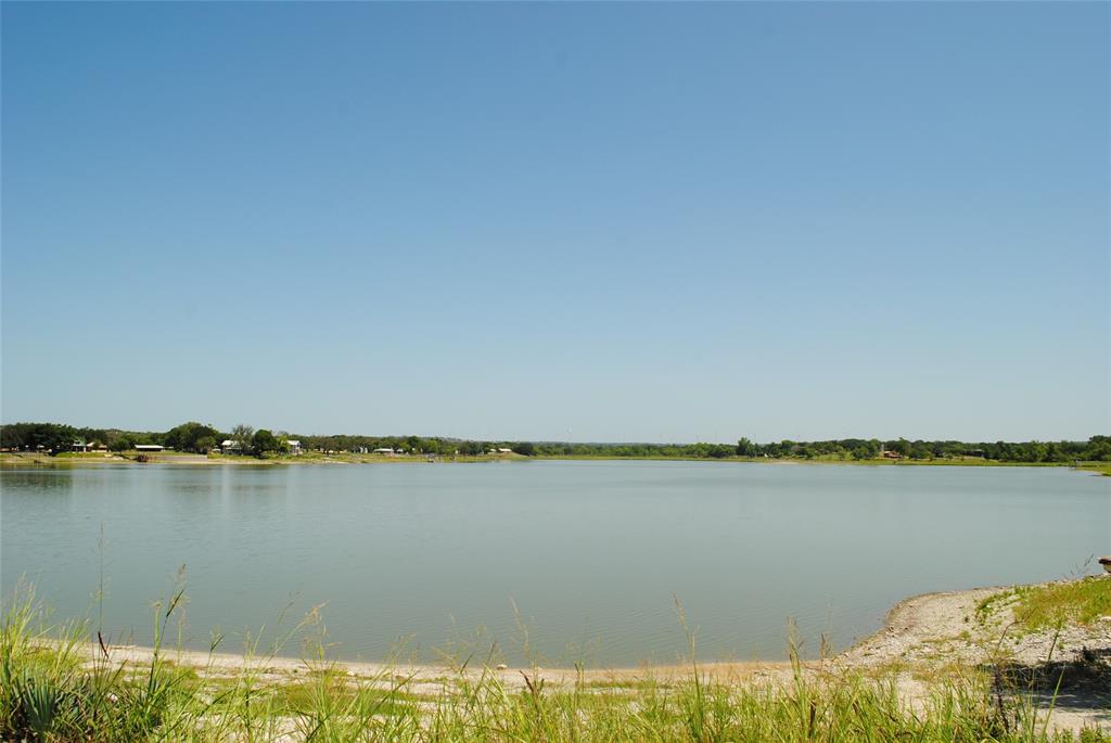 73-109 109th Goldthwaite, TX 76844 - Photo 32 of 37 a view of a lake with houses in the back
