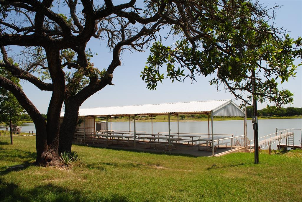 73-109 109th Goldthwaite, TX 76844 - Photo 33 of 37 a view of swimming pool with lawn chairs under an umbrella