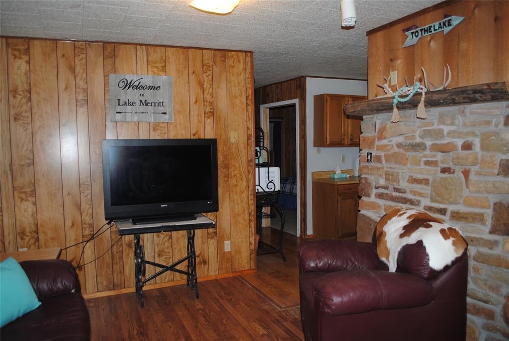 73-109 109th Goldthwaite, TX 76844 - Photo 7 of 37 a living room with furniture and a flat screen tv