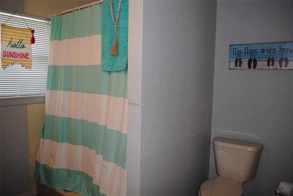 73-109 109th Goldthwaite, TX 76844 - Photo 10 of 37 a bathroom with a toilet and a shower