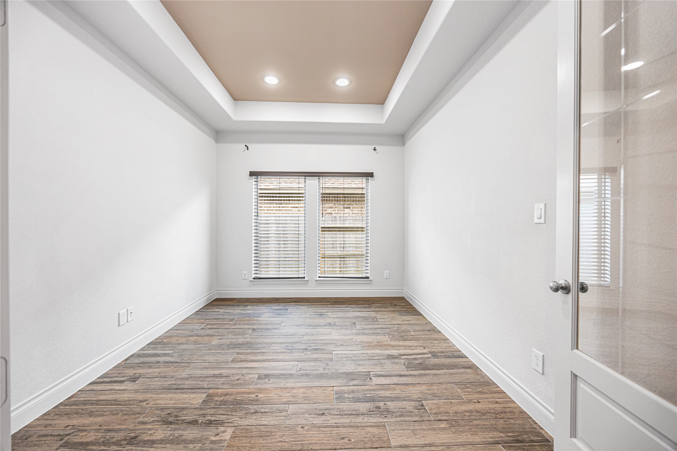 28169 Knight Peak Drive Spring, TX 77386 - Photo 18 of 33 a view of an empty room with wooden floor and a window