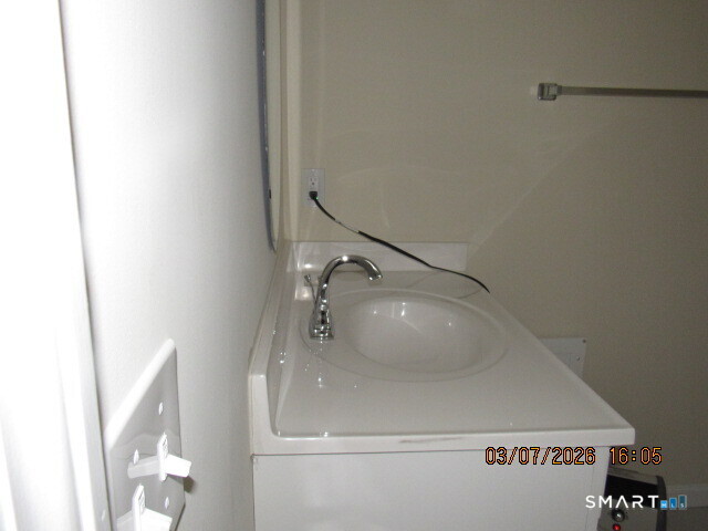 57 Warm Earth Road Naugatuck, CT 06770 - Photo 13 of 24 a bathroom with a sink and mirror