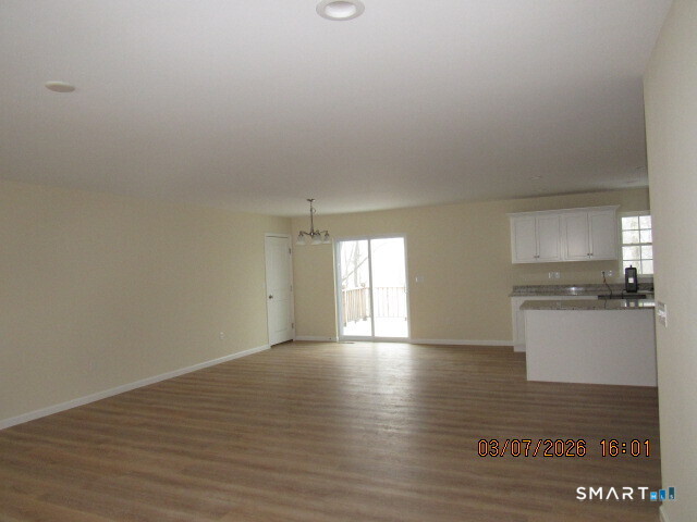 57 Warm Earth Road Naugatuck, CT 06770 - Photo 3 of 24 a view of a kitchen with a sink and a window