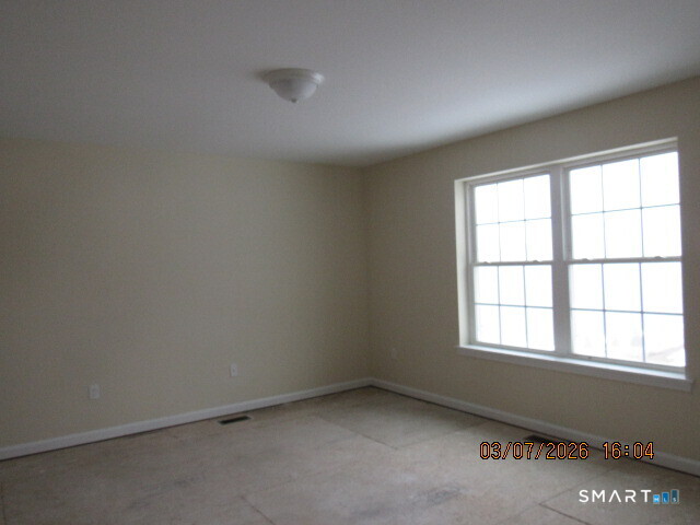 57 Warm Earth Road Naugatuck, CT 06770 - Photo 9 of 24 an empty room with a window