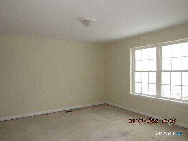 57 Warm Earth Road Naugatuck, CT 06770 - Photo 10 of 24 an empty room with a window