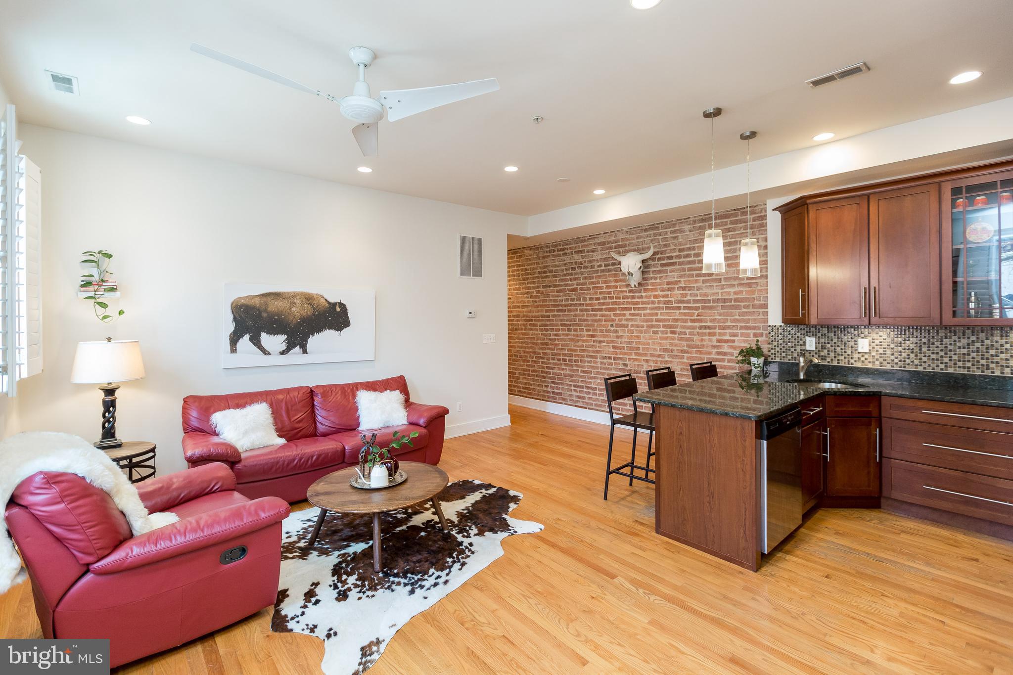 High ceilings and exposed brick wall through out